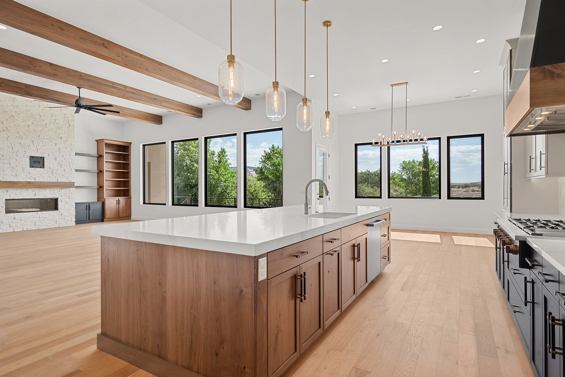 Spacious kitchen island with a white countertop and wood-finish cabinetry