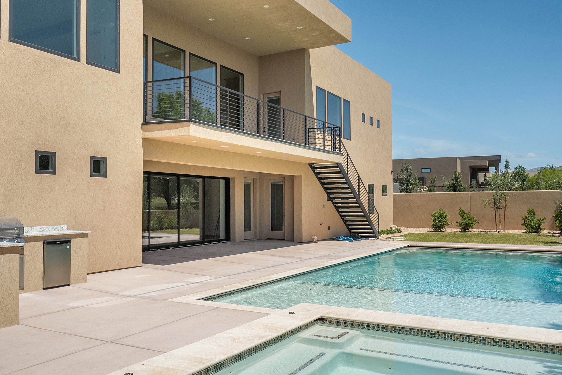 Contemporary exterior featuring a private pool and integrated spa