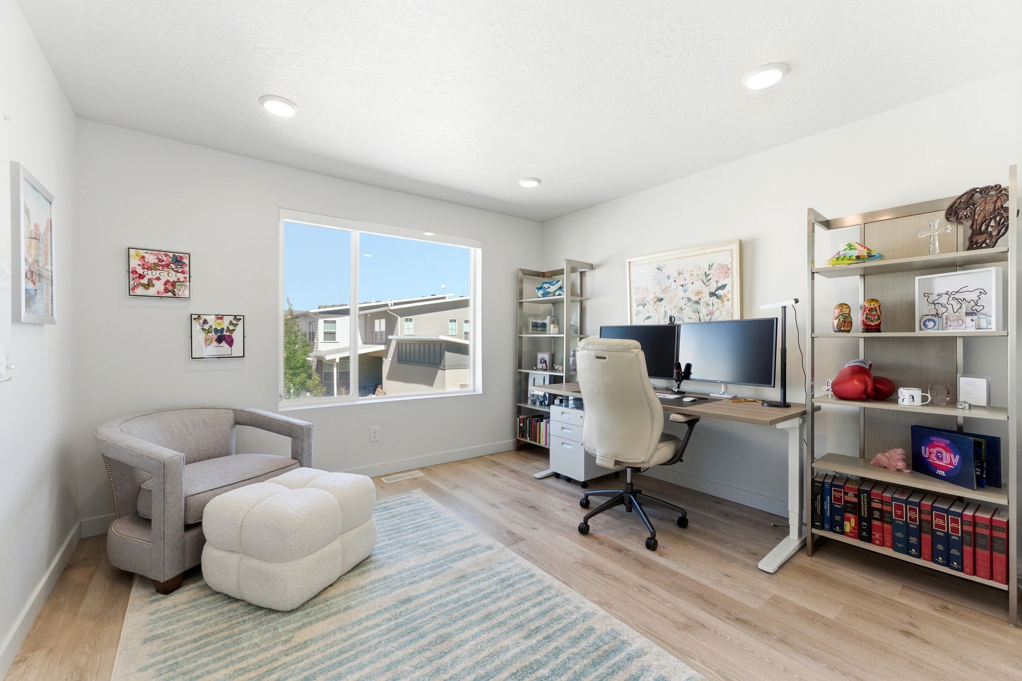 Light-filled interior space featuring wood-finish flooring, recessed lighting, and a large window