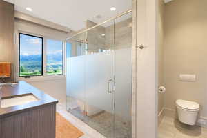 Modern bathroom with a glass-enclosed shower featuring a frosted privacy panel, a wall-mounted toilet, and a vanity with an integrated sink and wood-finish cabinetry
