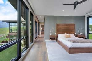 Bedroom featuring floor-to-ceiling windows, wood-finish flooring, recessed lighting, and a modern ceiling fan