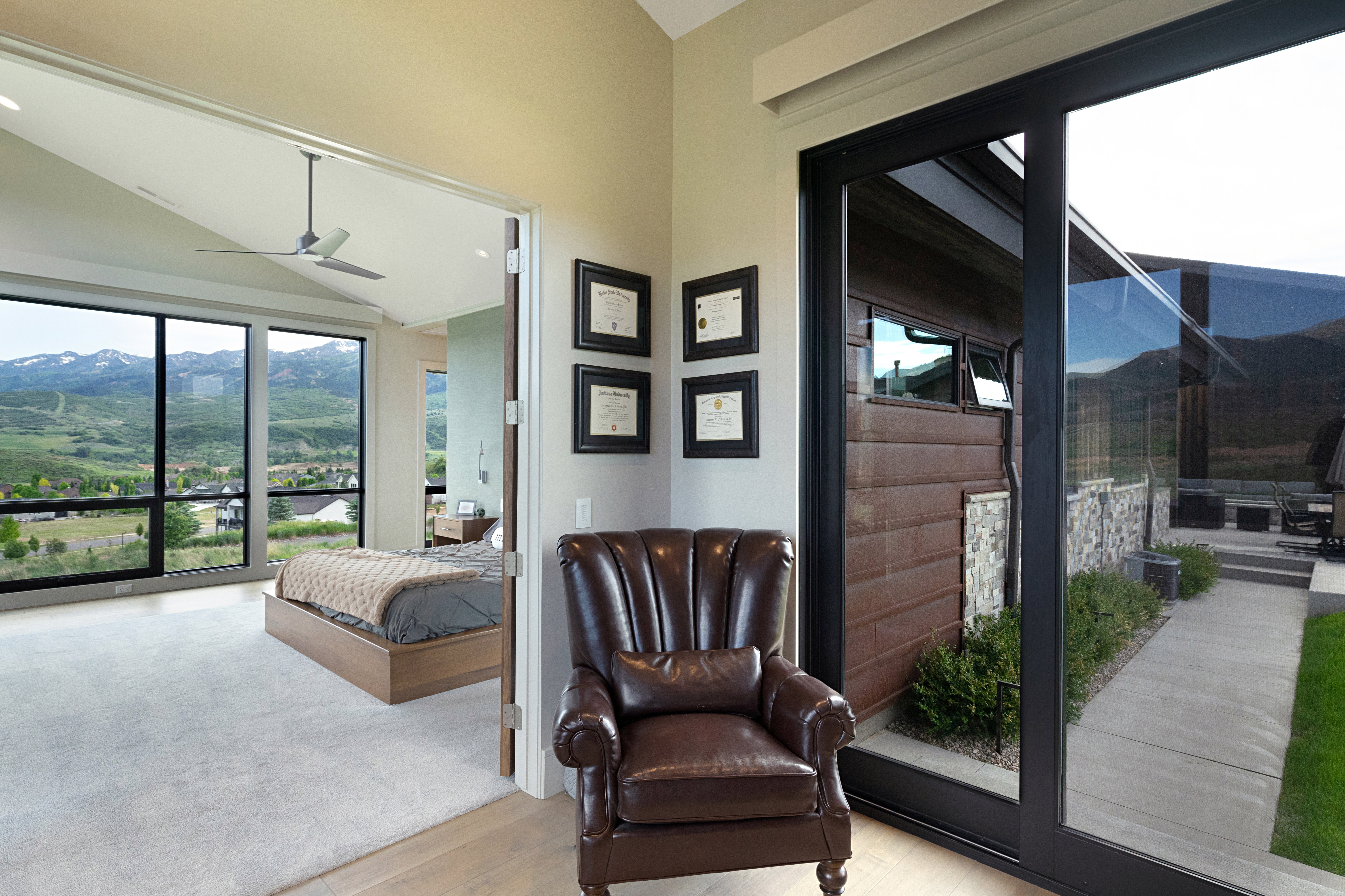 Expansive floor-to-ceiling windows with mountain scenery
