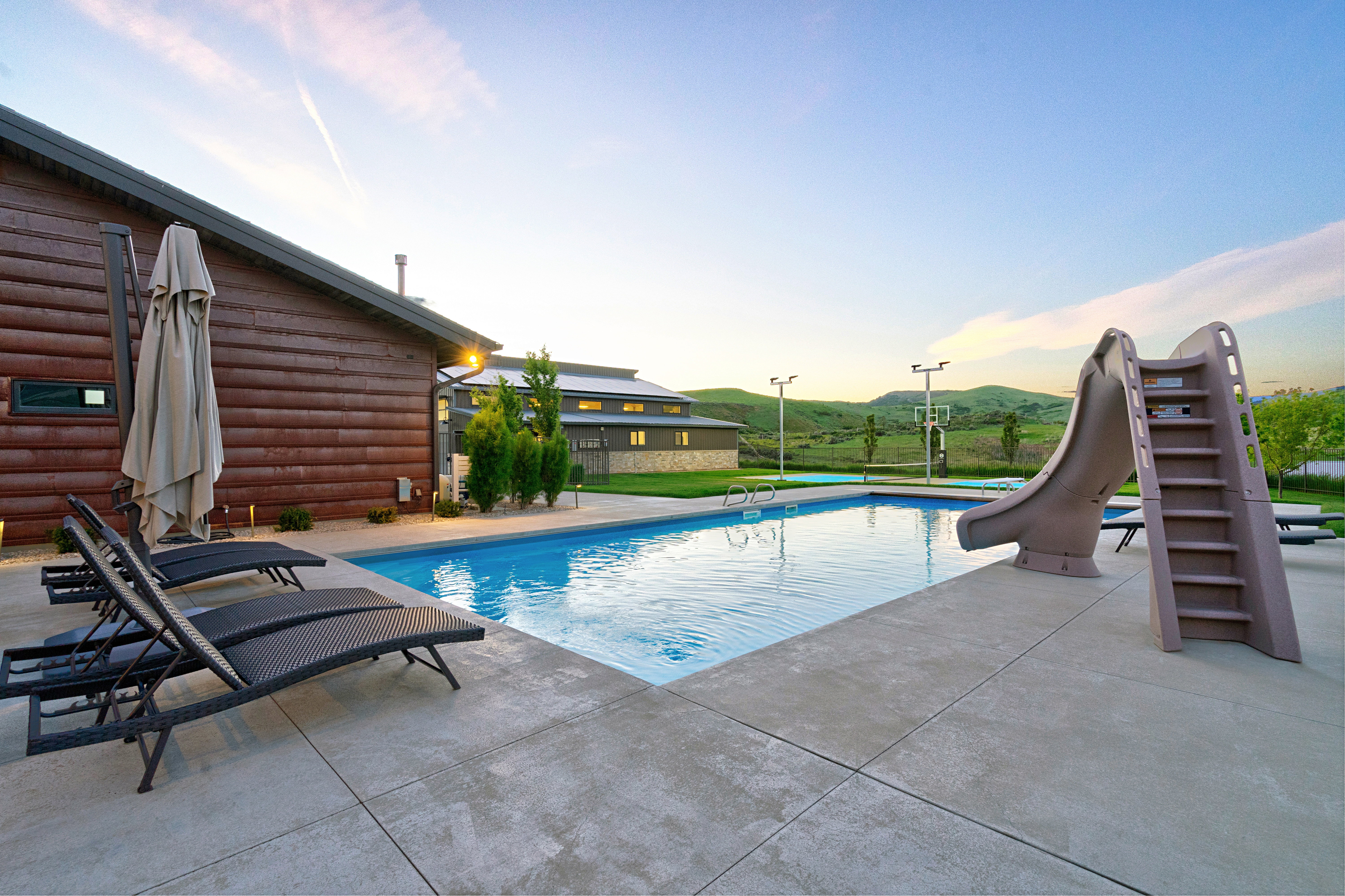 Outdoor swimming pool with concrete surround