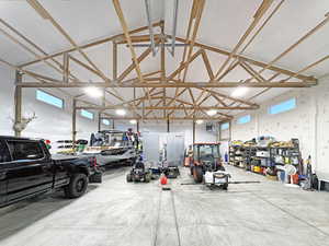 Spacious interior structure featuring exposed timber framing and a high vaulted ceiling