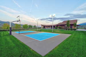 Multi-sport court featuring a basketball hoop and pickleball lines