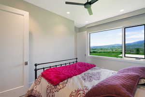 Expansive window offering a sweeping landscape with distant mountains