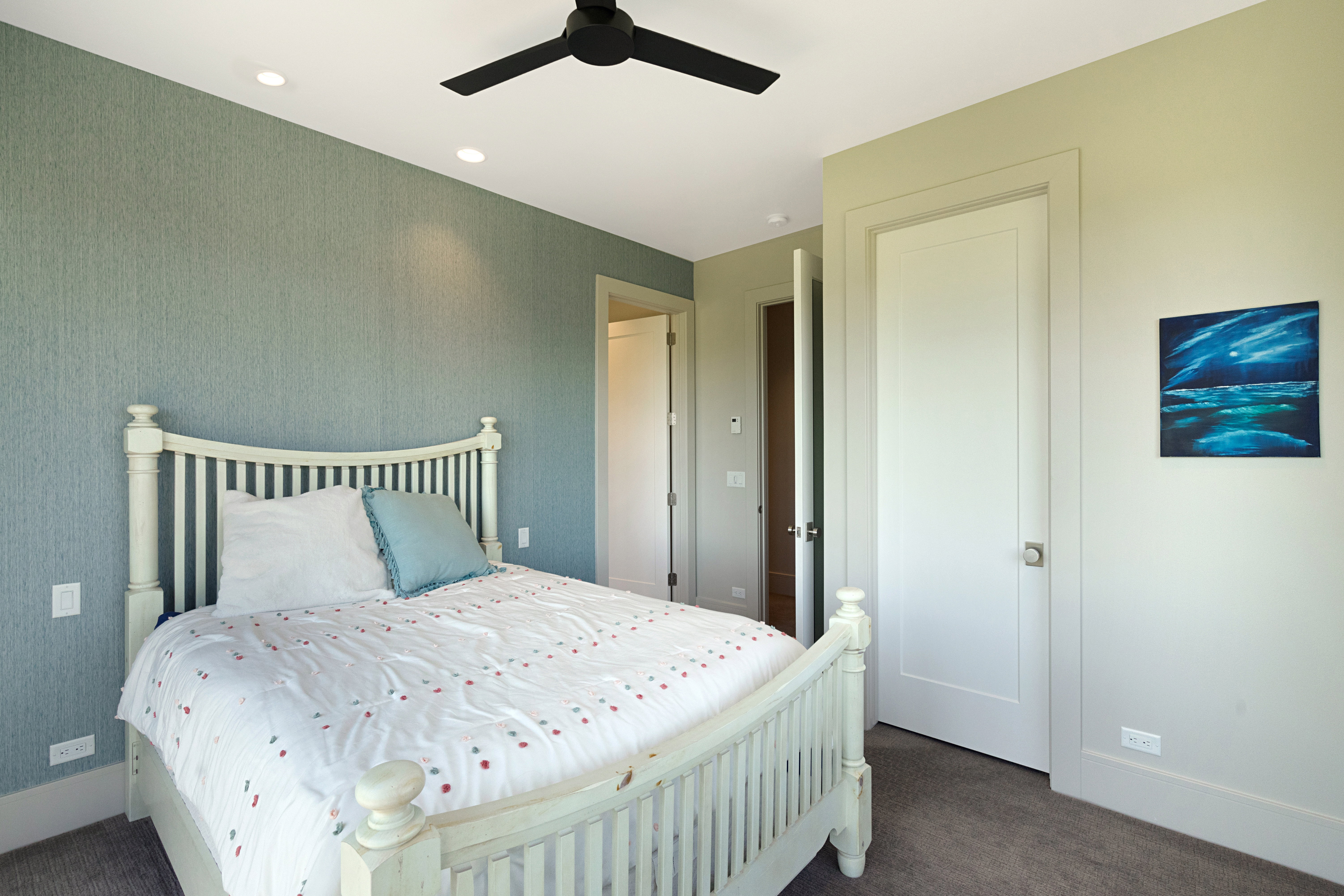 Bedroom featuring textured wall covering, recessed lighting, ceiling fan, and carpeted flooring