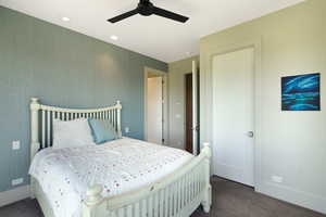 Bedroom featuring textured wall covering, recessed lighting, ceiling fan, and carpeted flooring