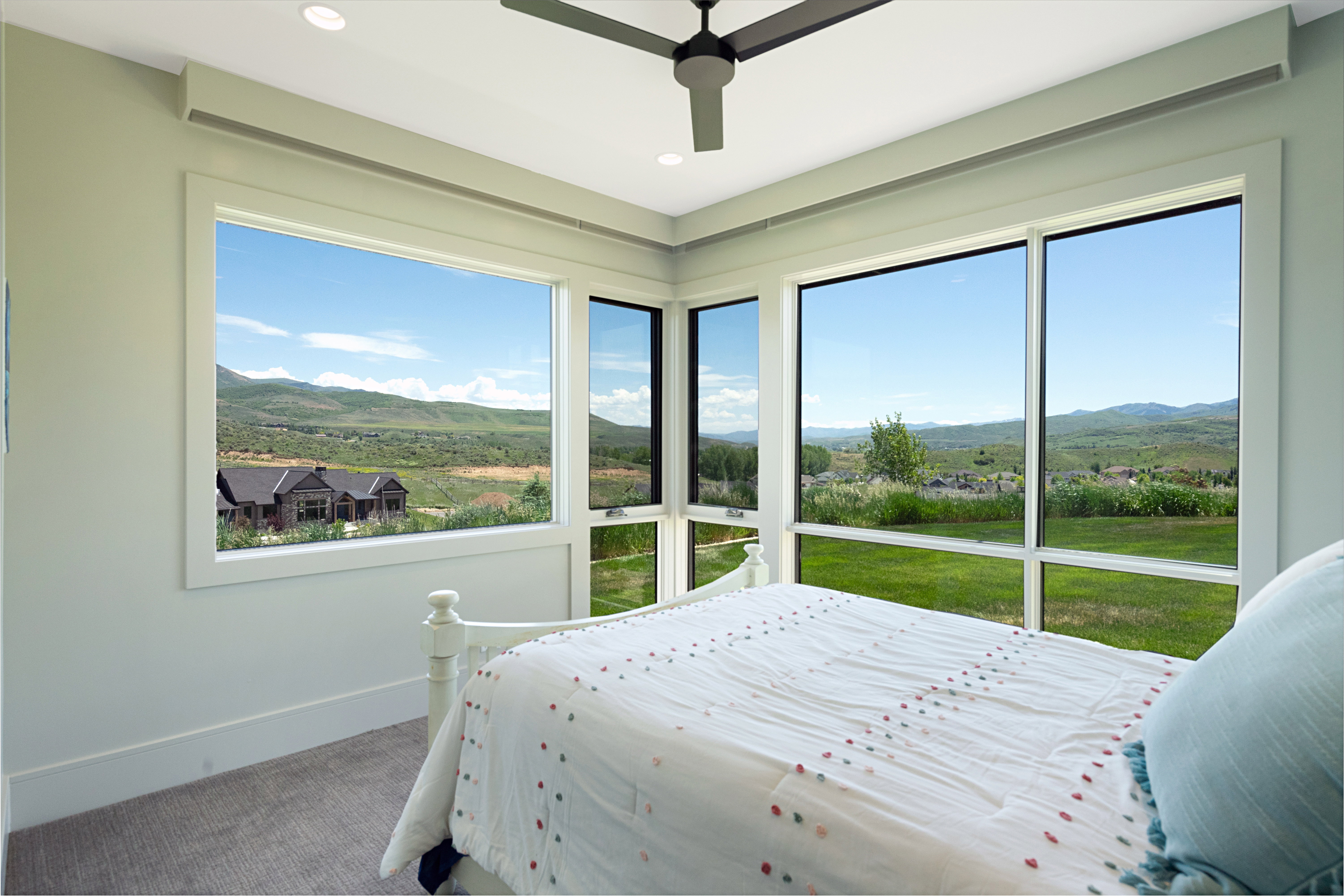 Expansive windows framing mountain and landscape scenery