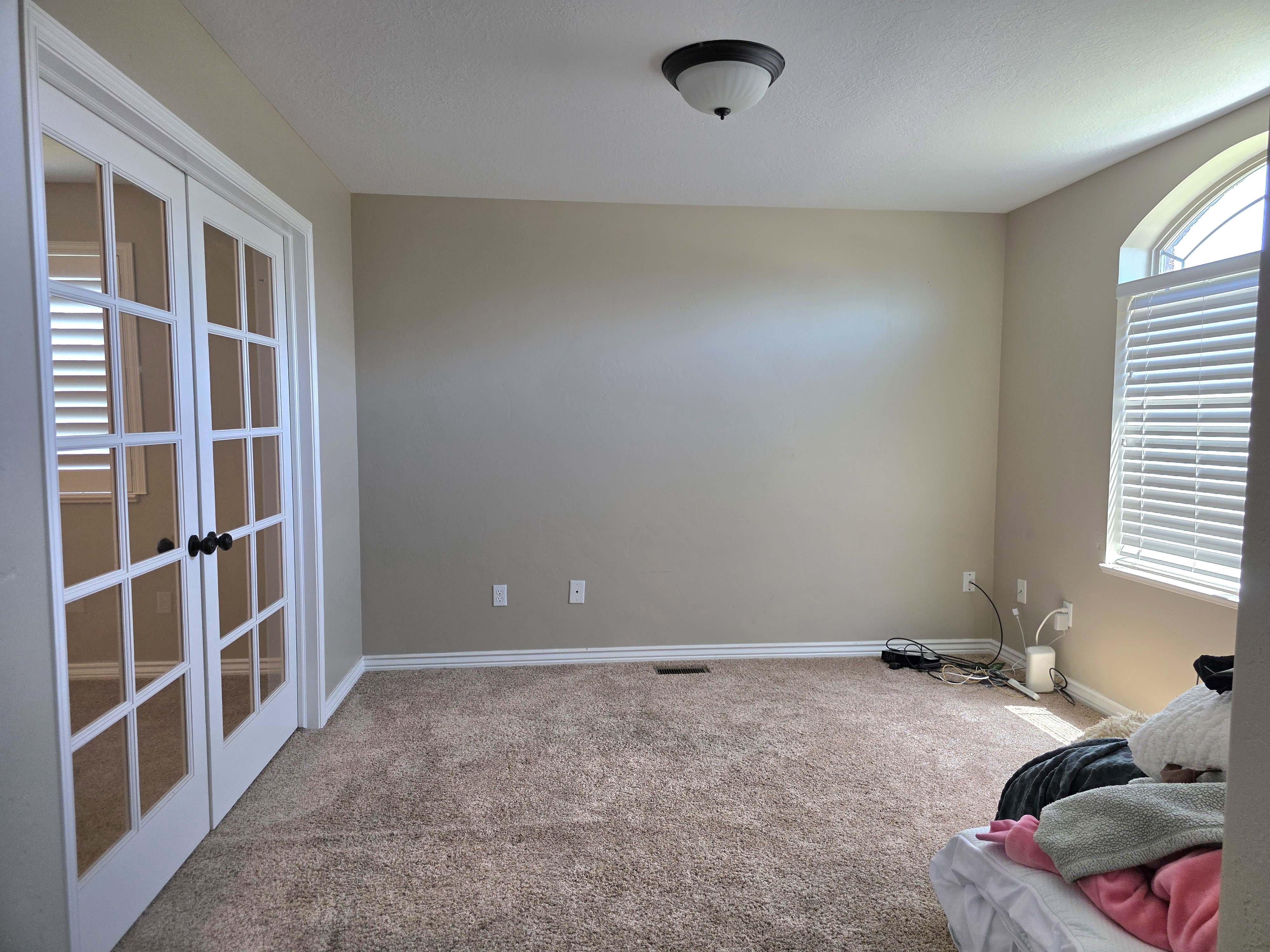 Room featuring plush carpeting, neutral wall paint, and white baseboards