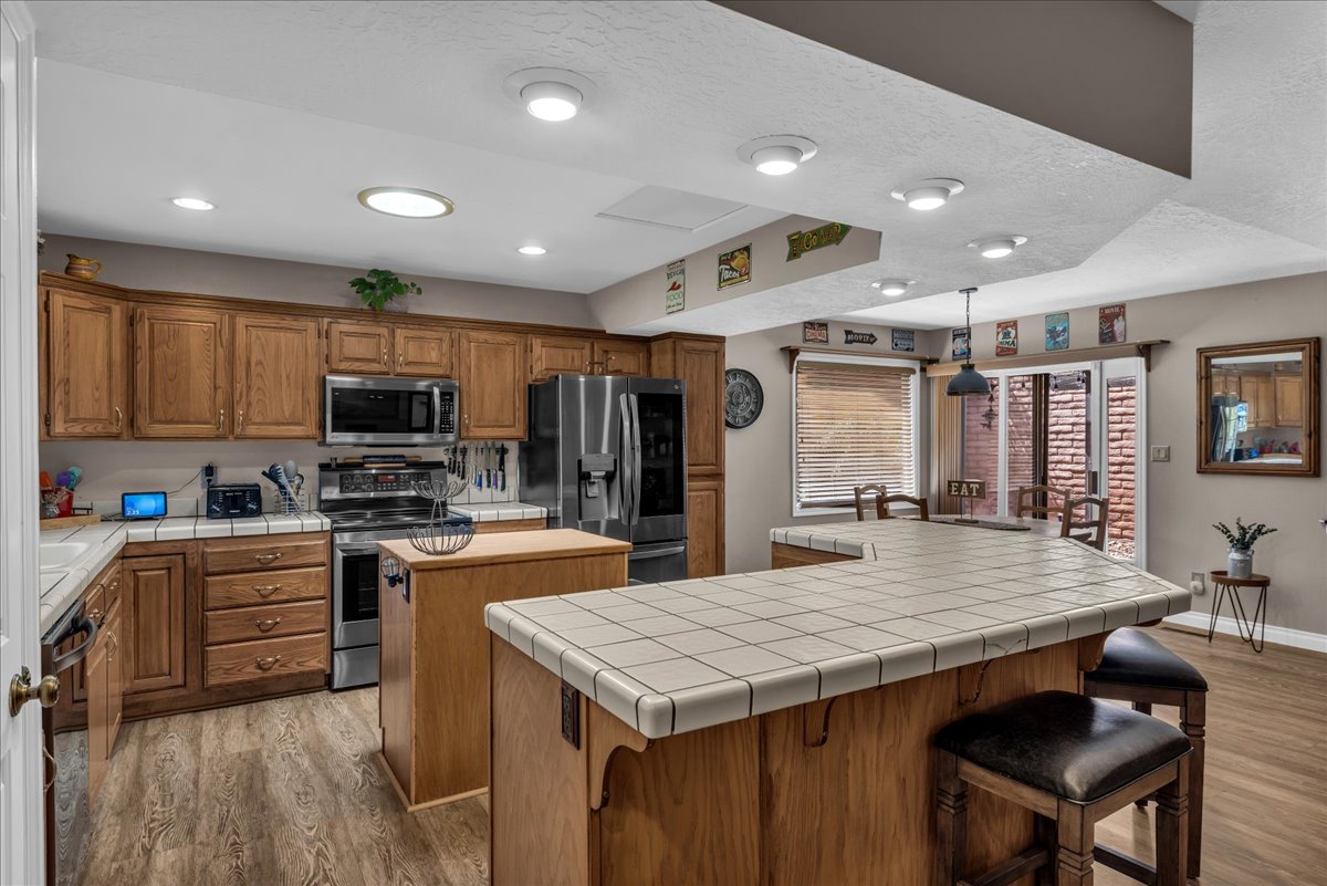 Kitchen - featuring wood prep island & extended breakfast bar