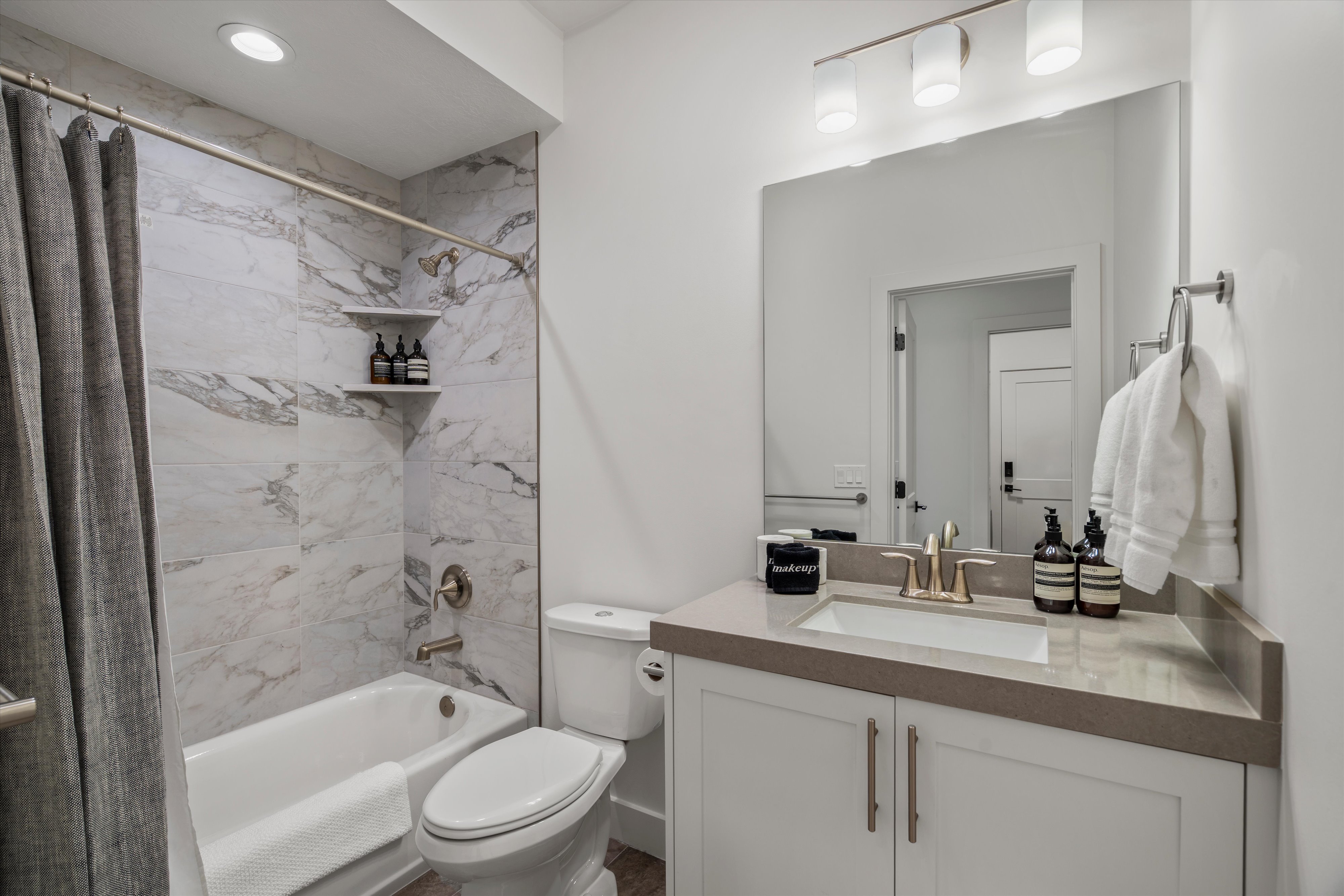 Full bath with tub and shower.
