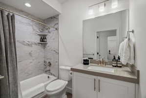 Full bath with tub and shower.