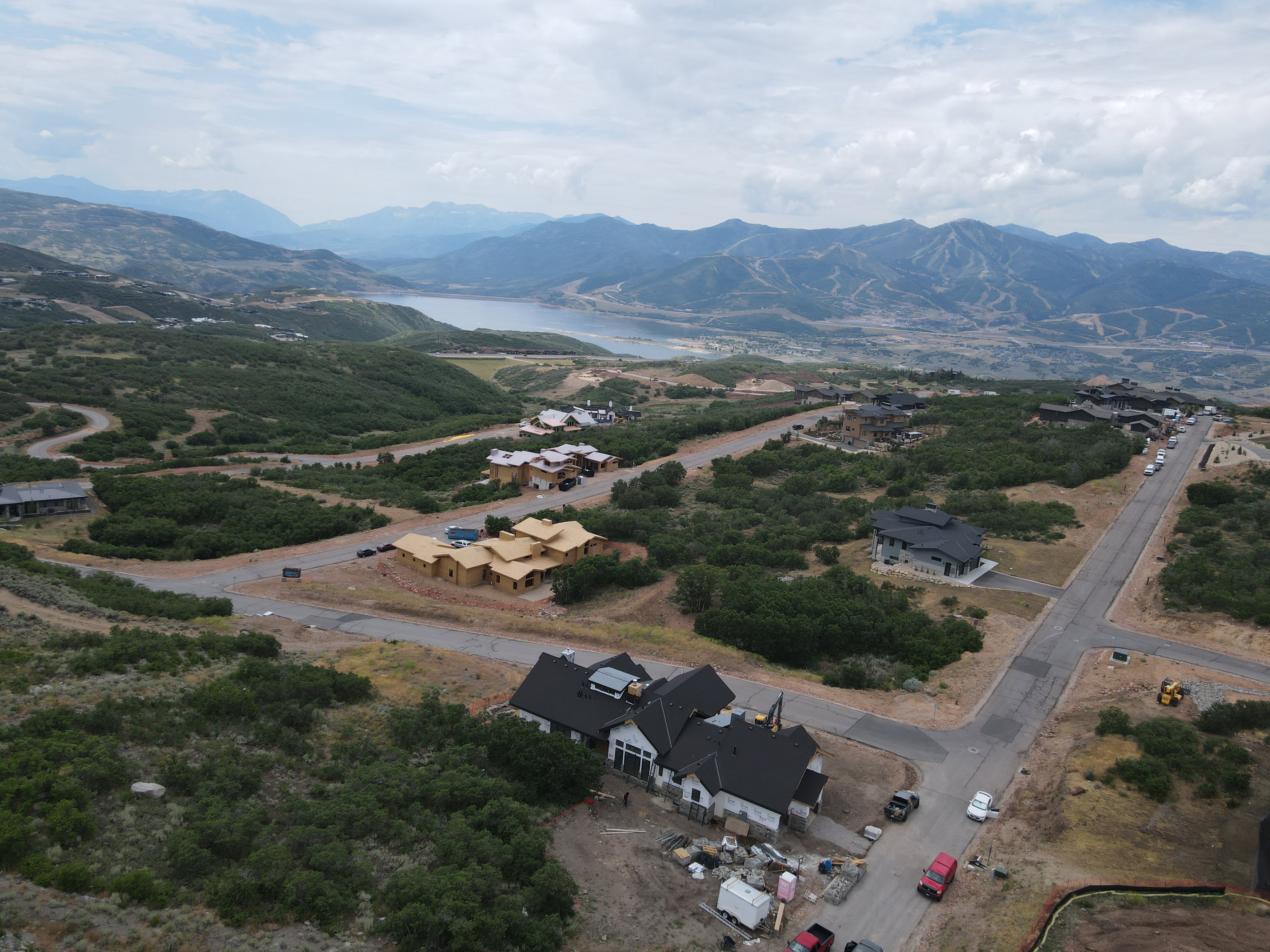 Bird's eye view above the home featuring a mountain backdrop