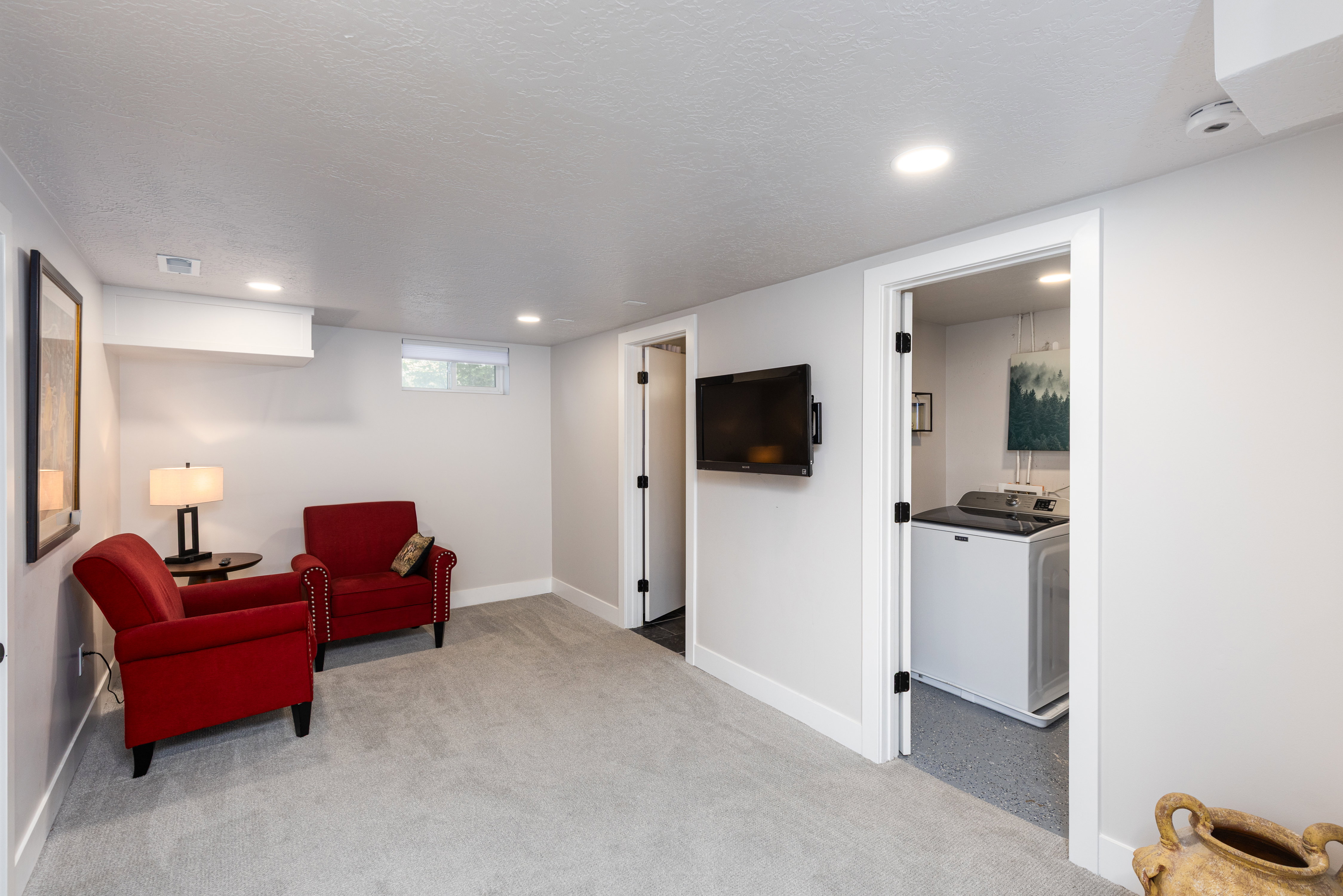 Carpeted interior space with recessed lighting and white baseboards