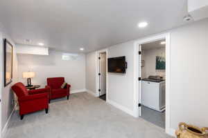 Carpeted interior space with recessed lighting and white baseboards