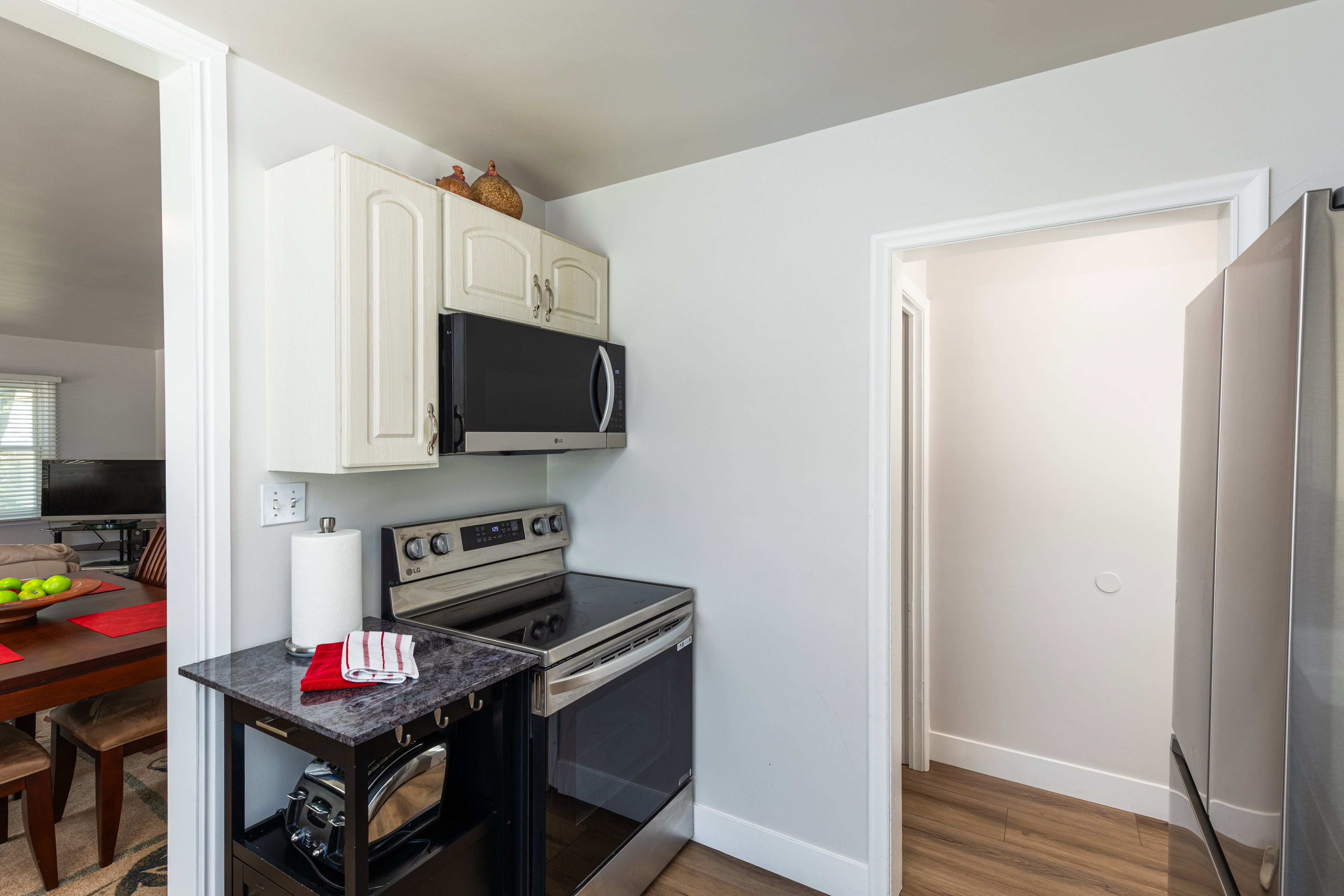 Stainless steel appliances, including an electric range and built-in microwave
