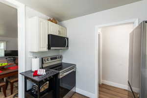 Stainless steel appliances, including an electric range and built-in microwave