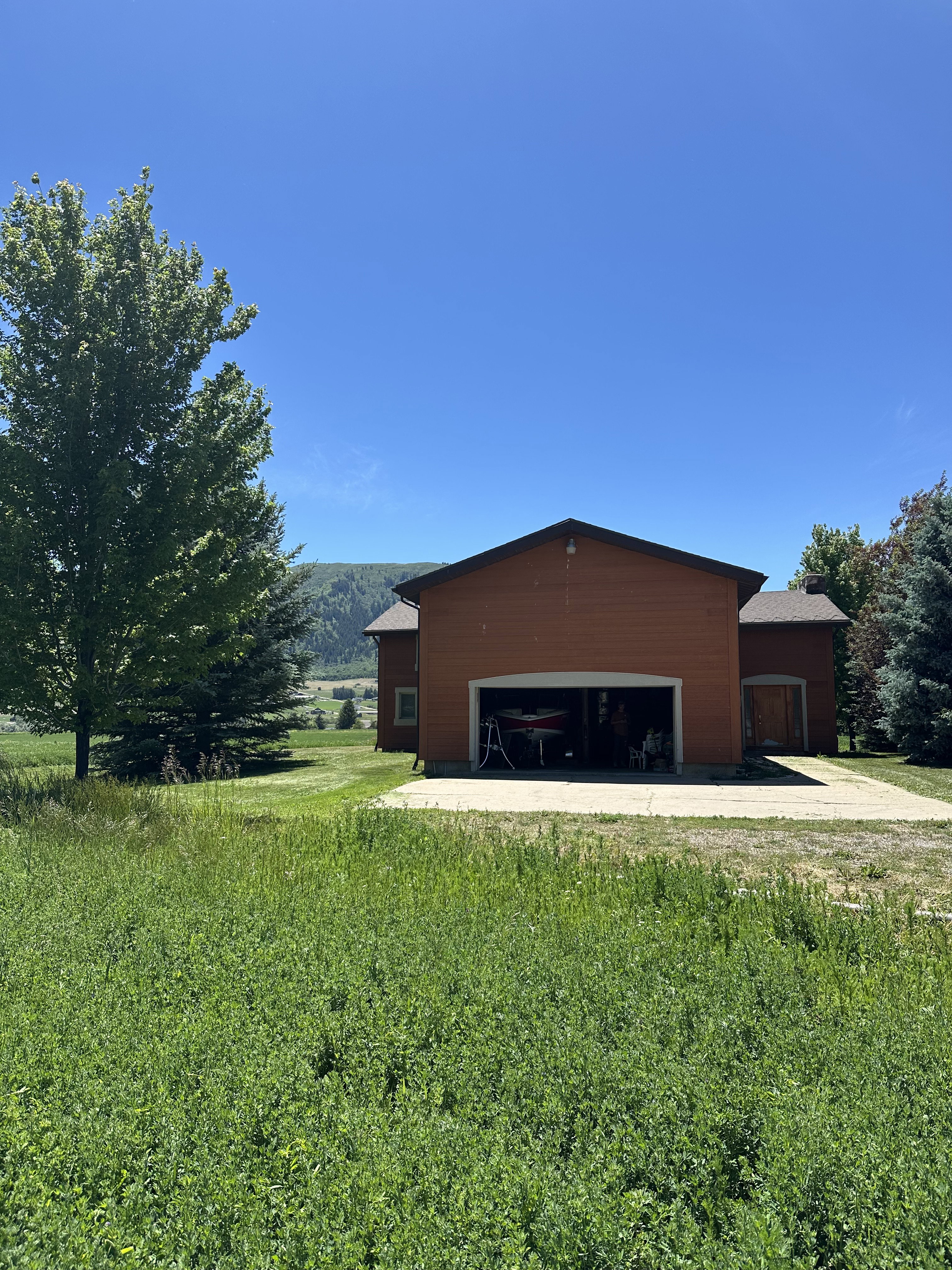 Attached two-car garage with a concrete driveway