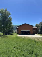 Attached two-car garage with a concrete driveway