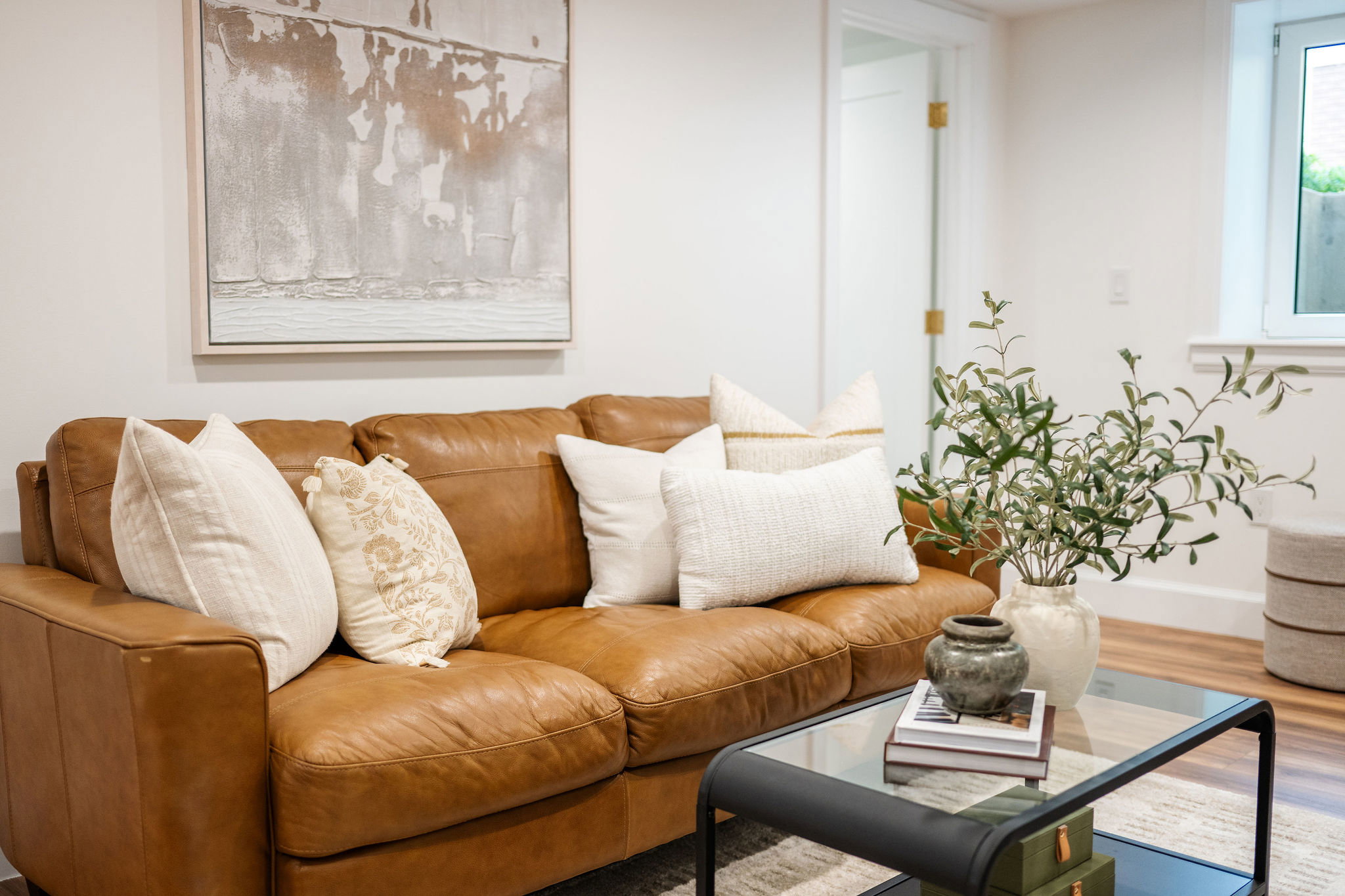 White walls complement the light wood-finish flooring