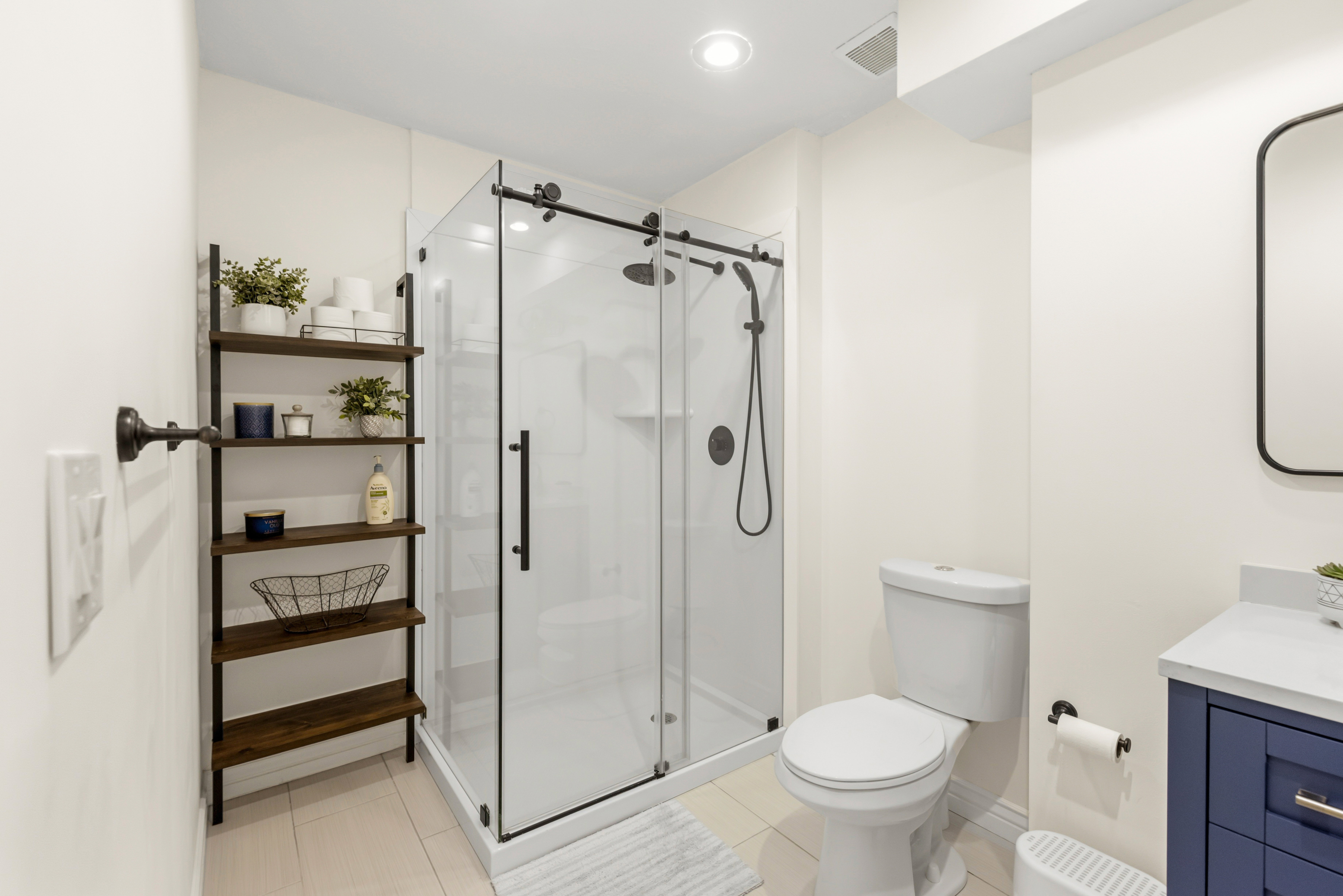 New glass shower doors with custom tile