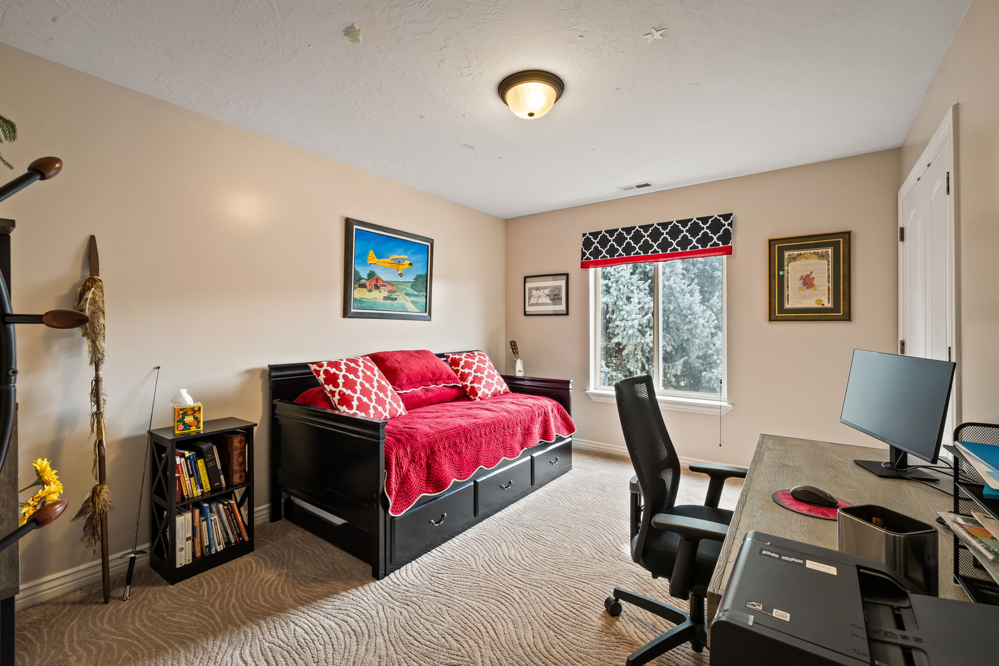 Bedroom with a desk and carpet flooring