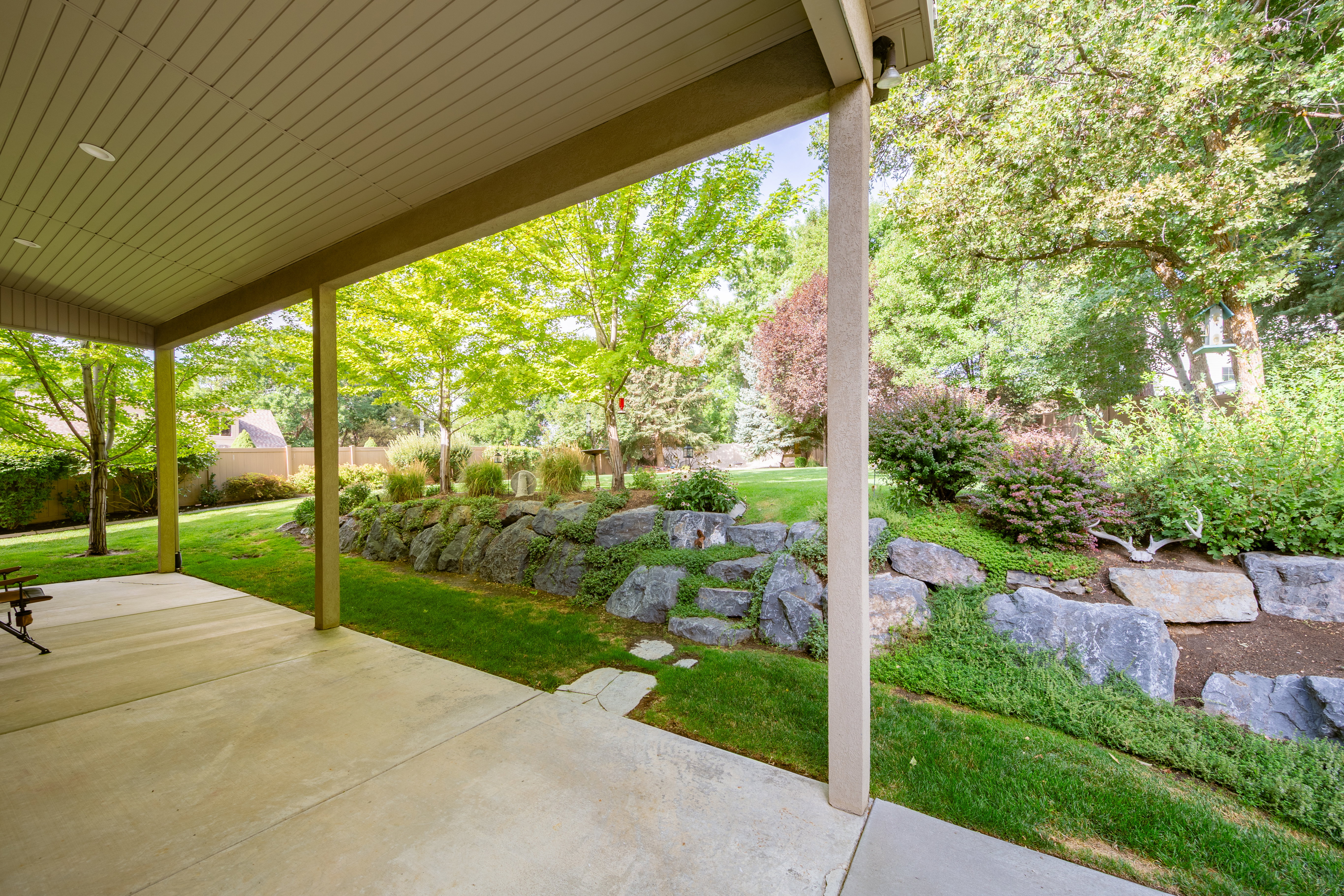 Covered patio with recessed lighting, concrete flooring, and support columns