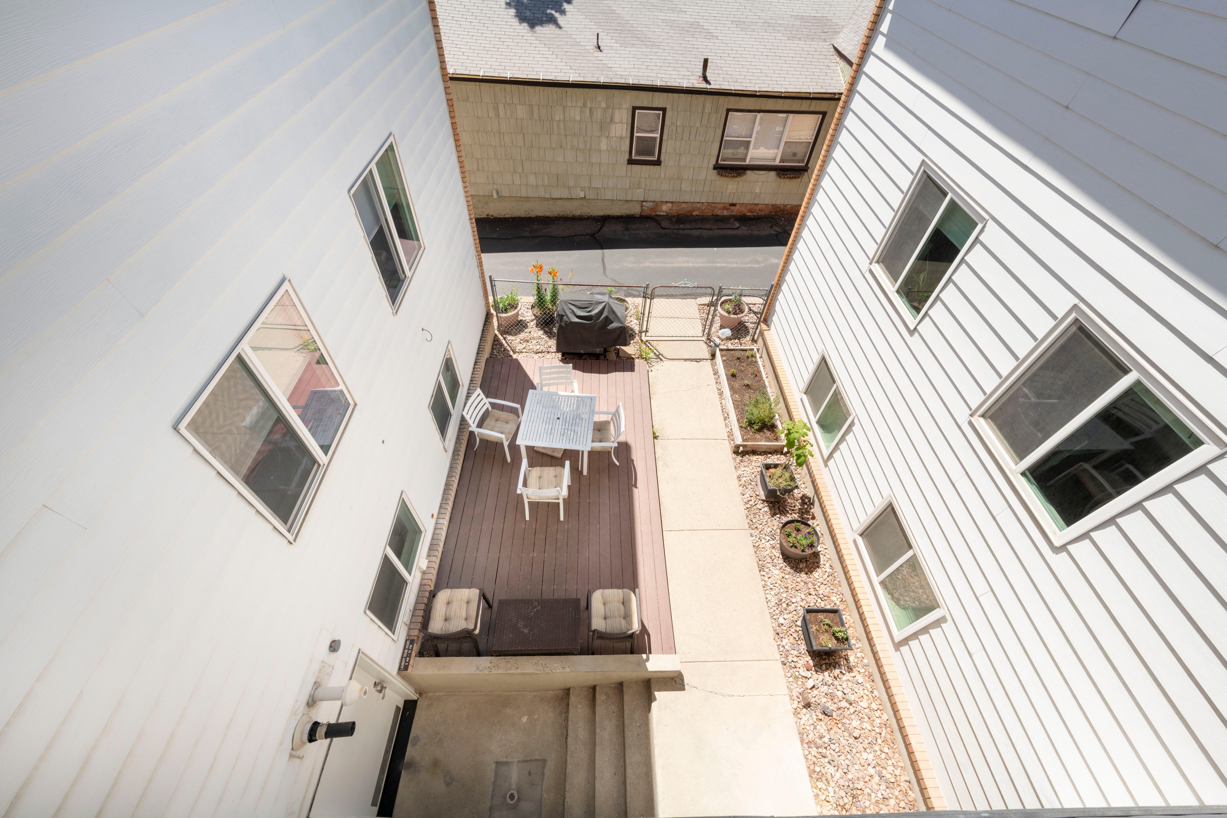 Outdoor decking area featuring a spacious dining arrangement