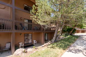 Multi-level building exterior featuring horizontal siding and dark trim