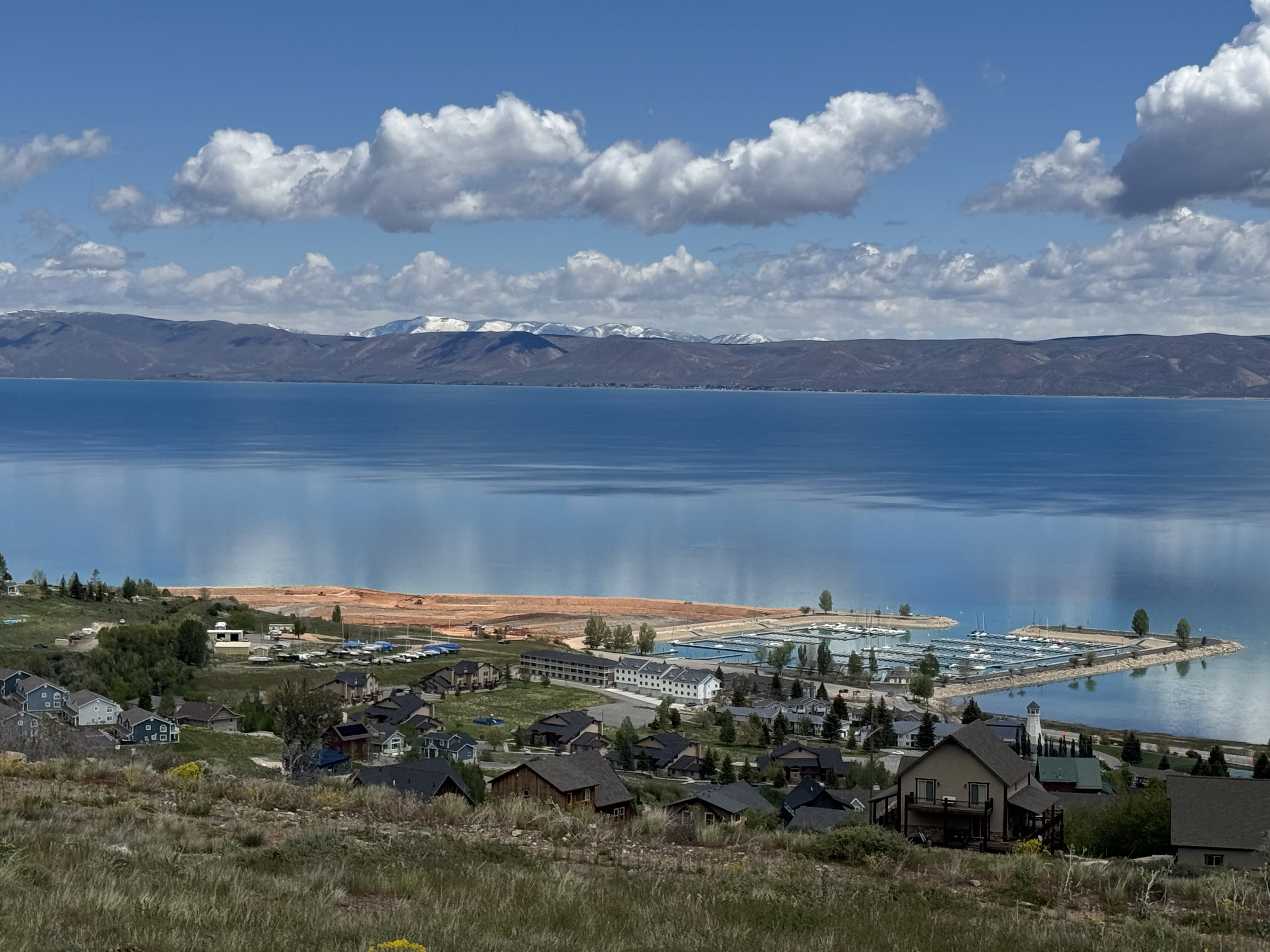 Expansive water body with a marina featuring multiple boat slips