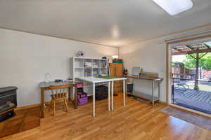 Warm wood-finish flooring complements light-toned walls