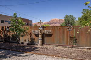 Corrugated metal fencing defines the property perimeter