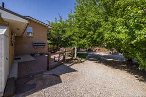 Expansive outdoor patio featuring brick pavers and flagstone accents