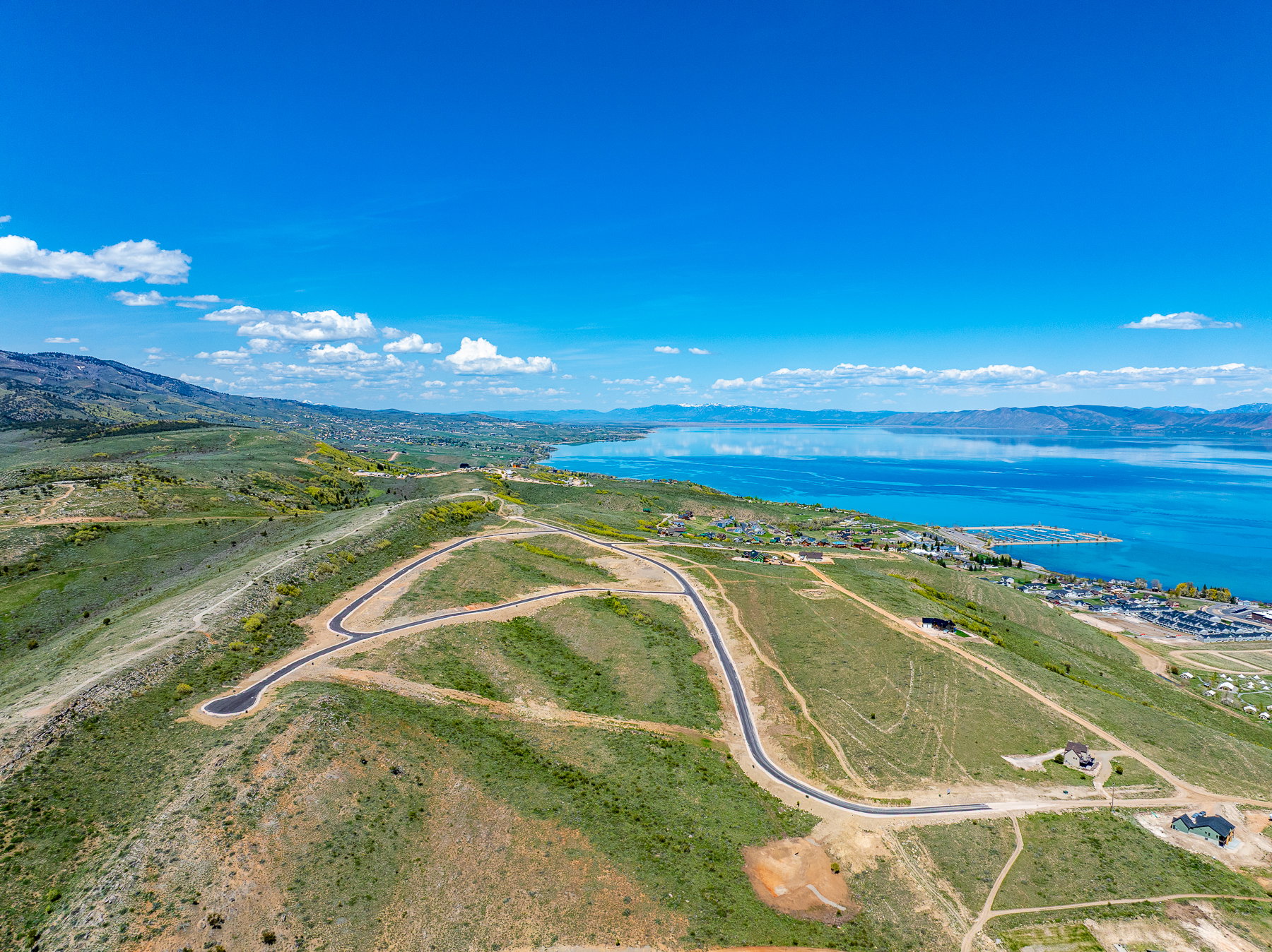 Expansive land parcels featuring paved roads and gentle slopes