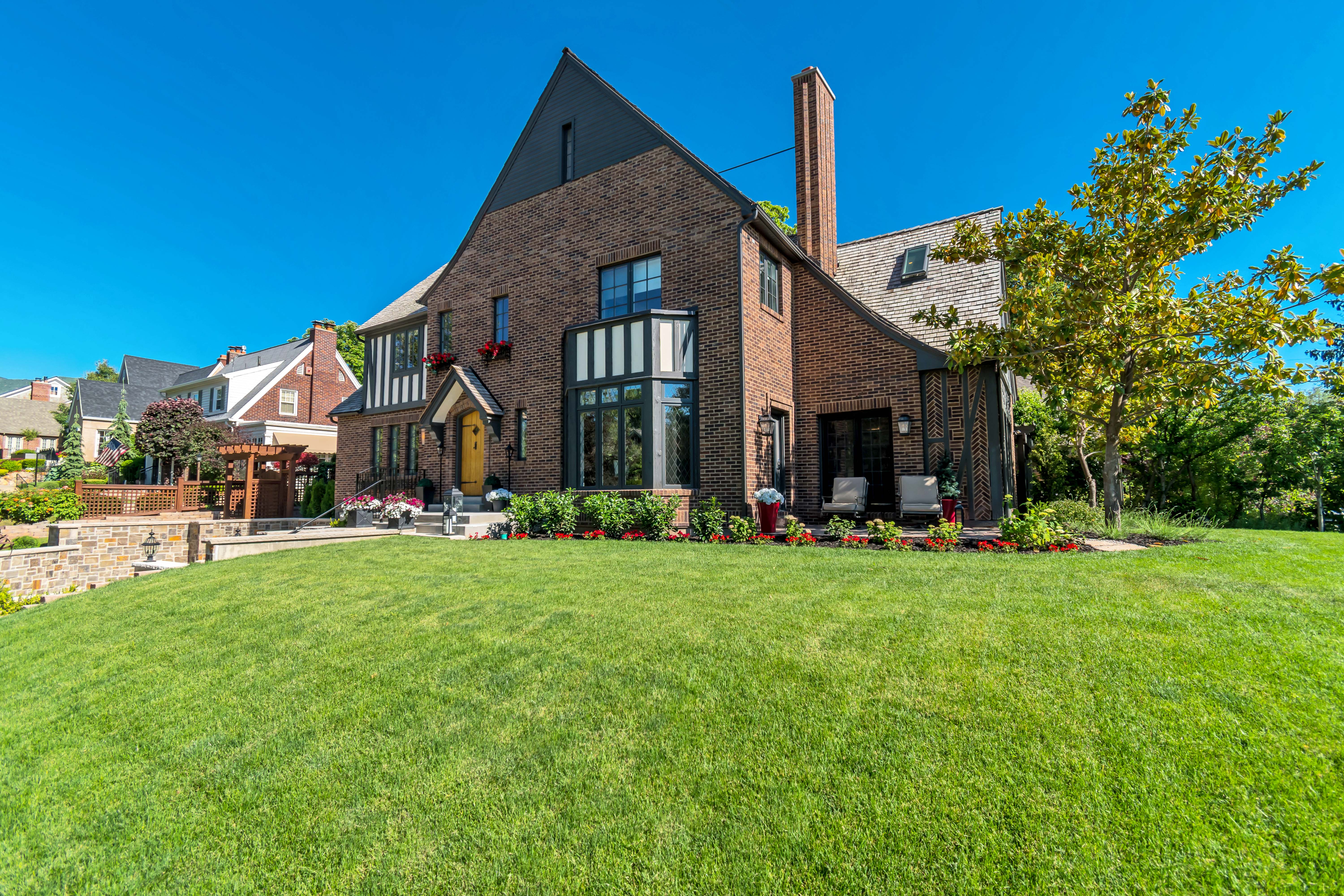 Brick exterior featuring a prominent gabled roofline and a front bay window