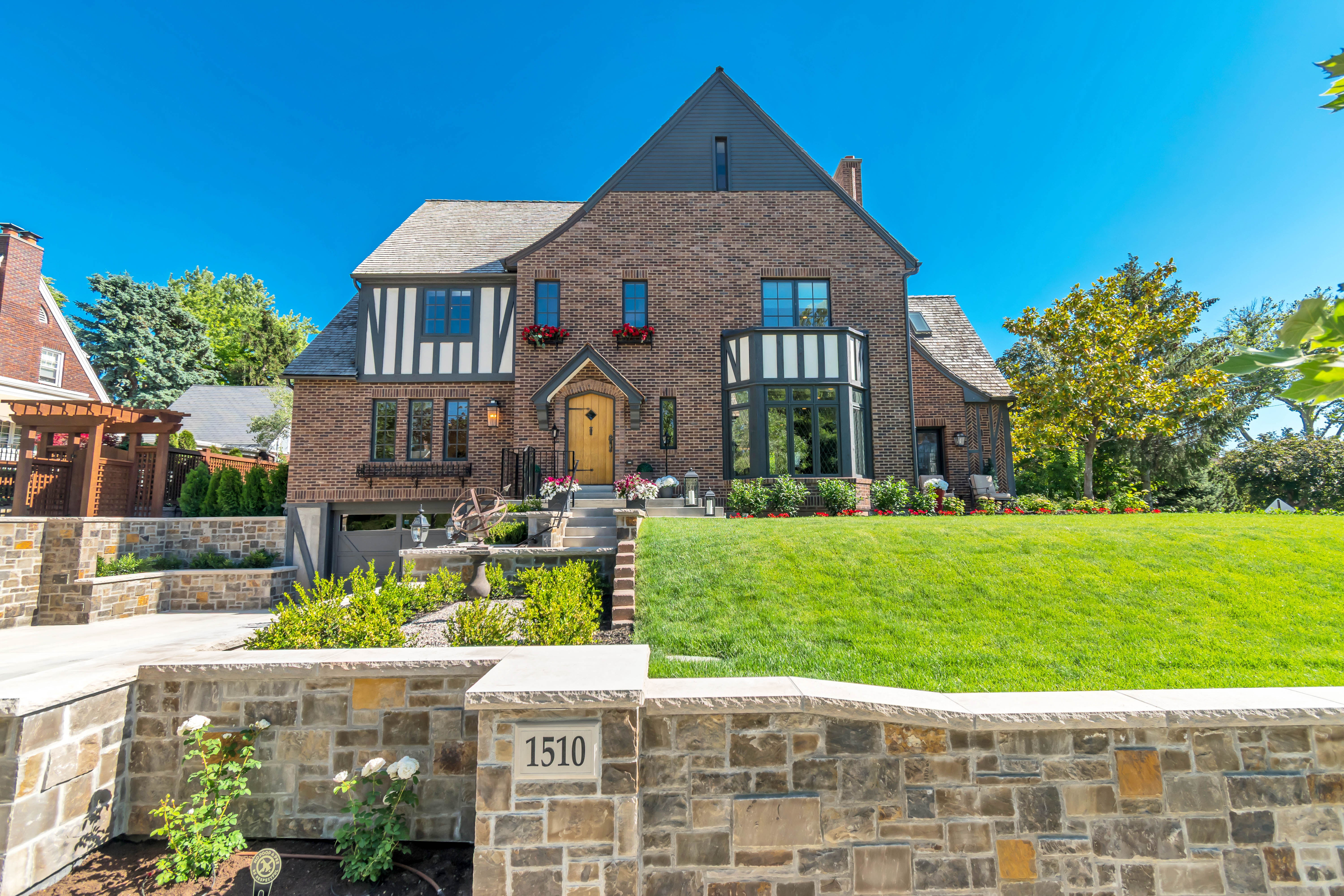 Brick and Tudor-style architecture with a prominent bay window