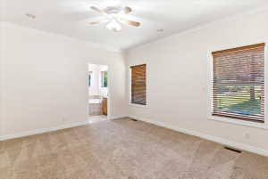 Carpeted room featuring crown molding, recessed lighting, and a ceiling fan
