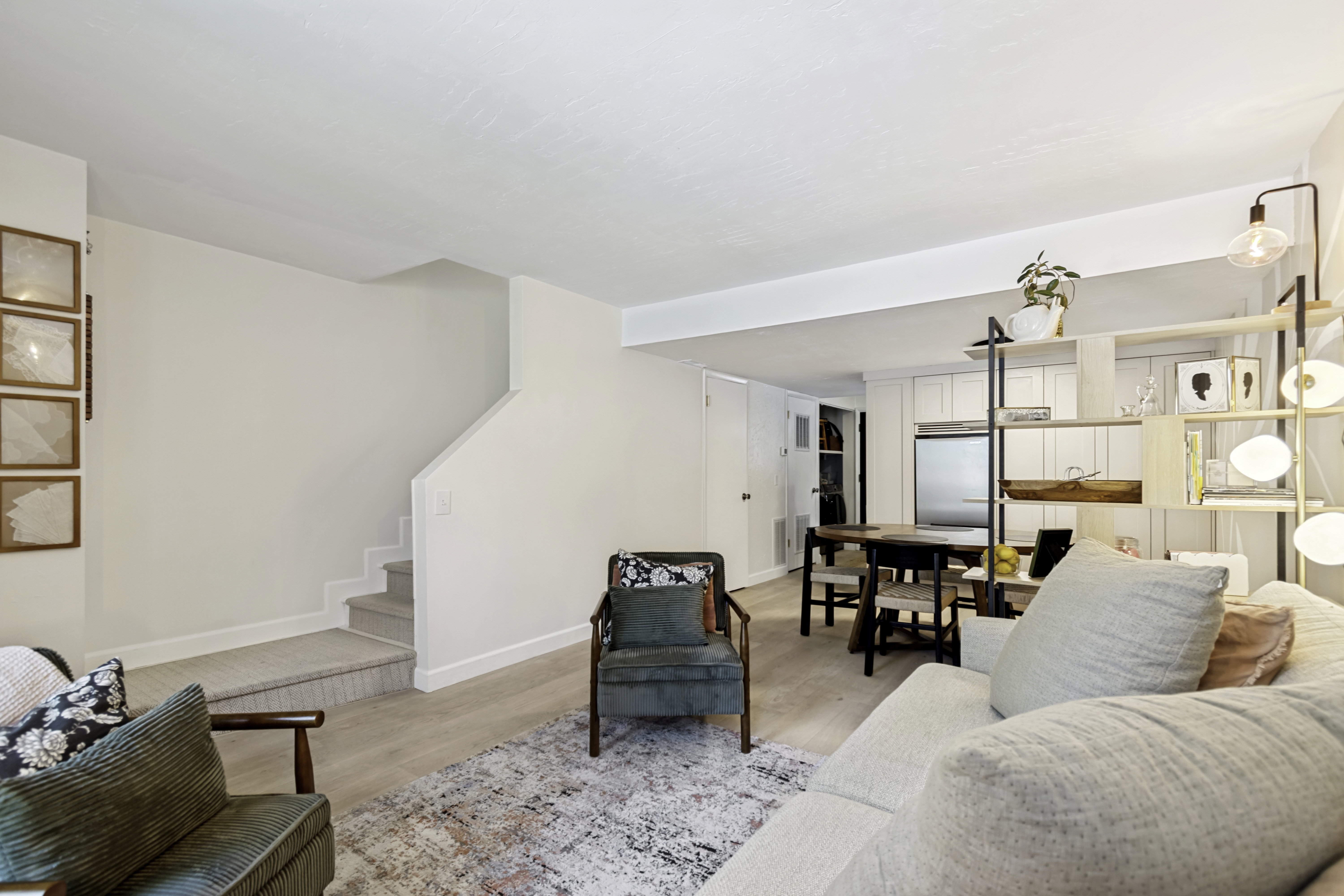 Open concept living area with light wood-finish flooring