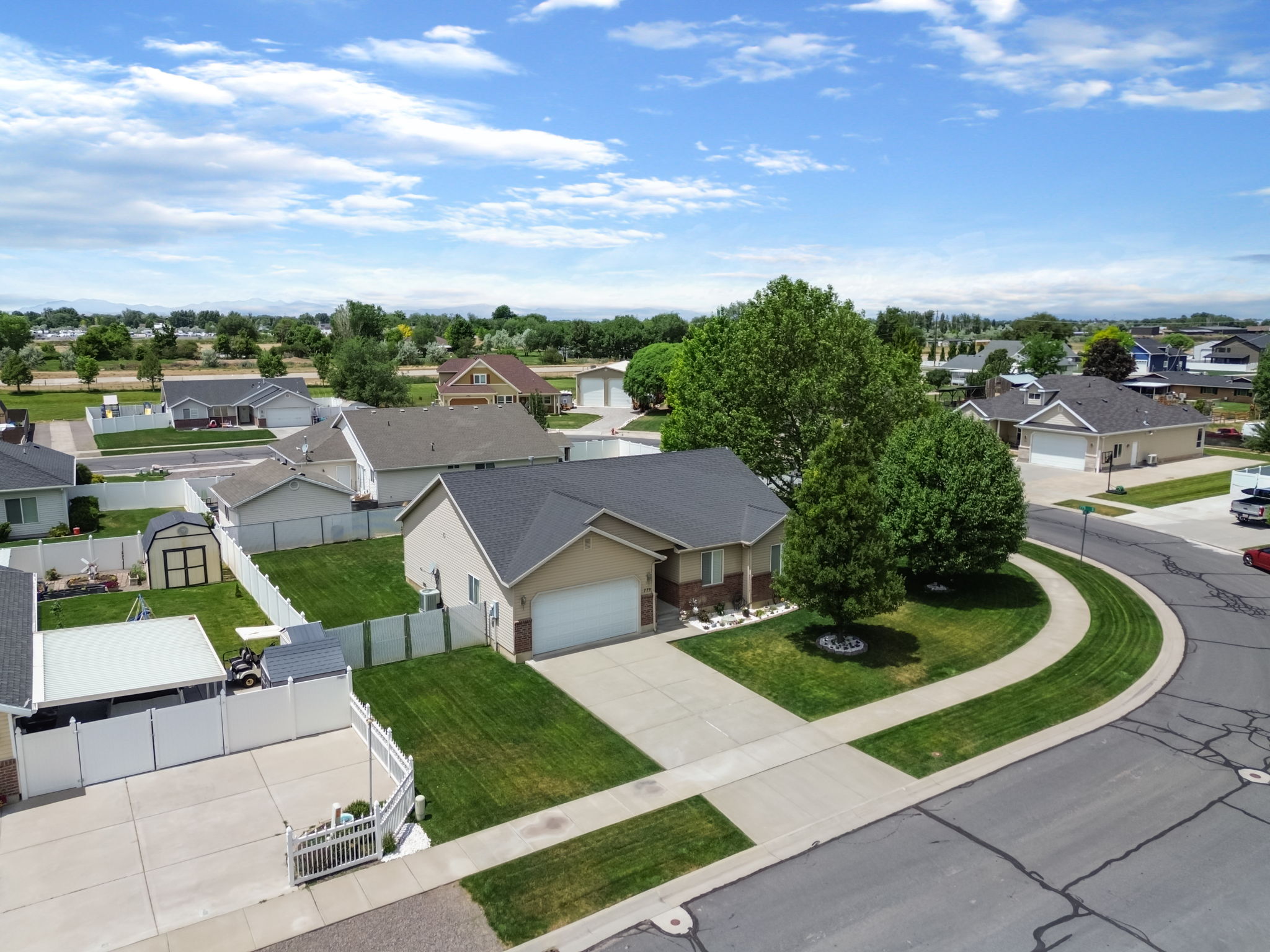 Single-story residence featuring a two-car garage and a paved driveway