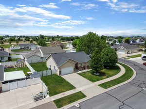 Single-story residence featuring a two-car garage and a paved driveway