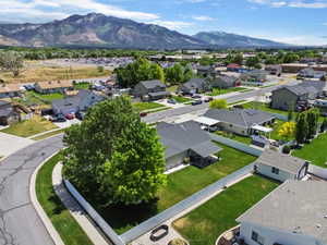 Expansive mountain scenery framing a residential neighborhood with varied architectural styles