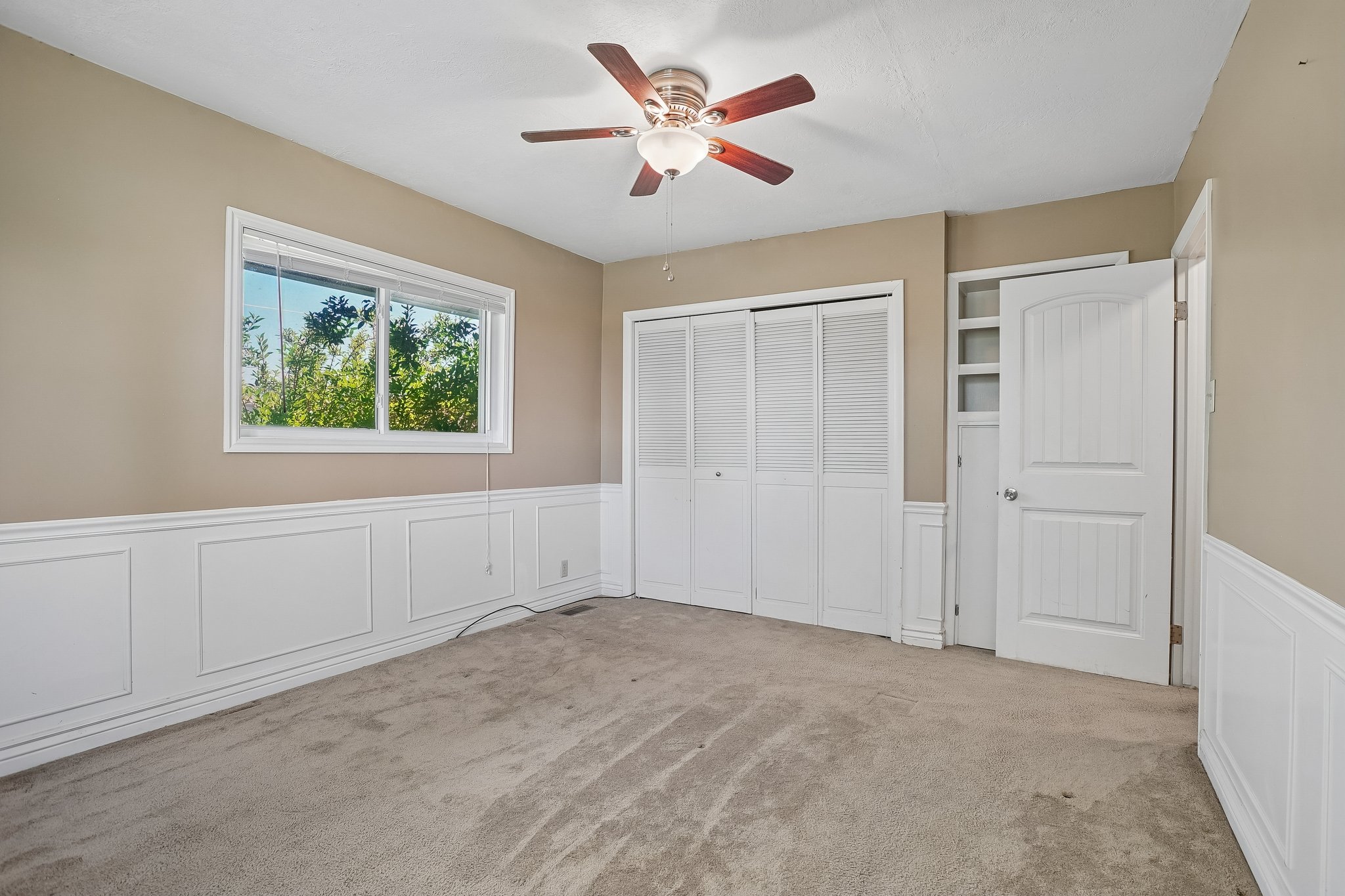 Interior room featuring neutral-toned walls and plush carpeting