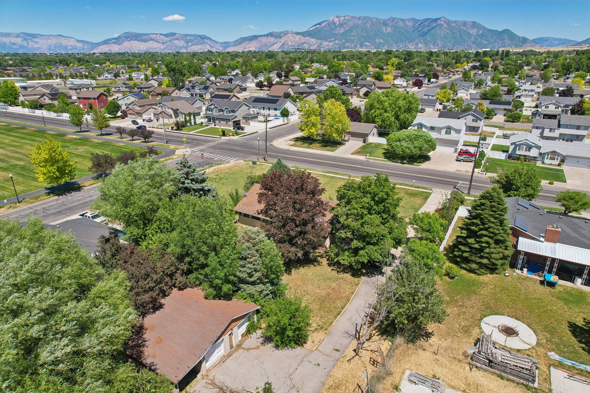 Expansive lot with mature trees and a detached garage structure