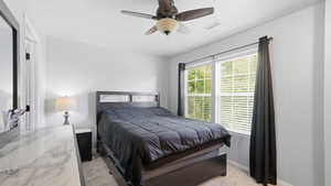 Bedroom featuring light gray wall paint and carpet flooring