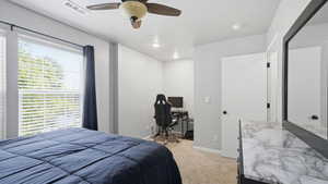 Carpeted bedroom featuring a ceiling fan with integrated lighting, recessed lighting, and a dedicated alcove