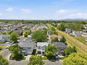 Suburban neighborhood setting with tree-lined streets and established homes