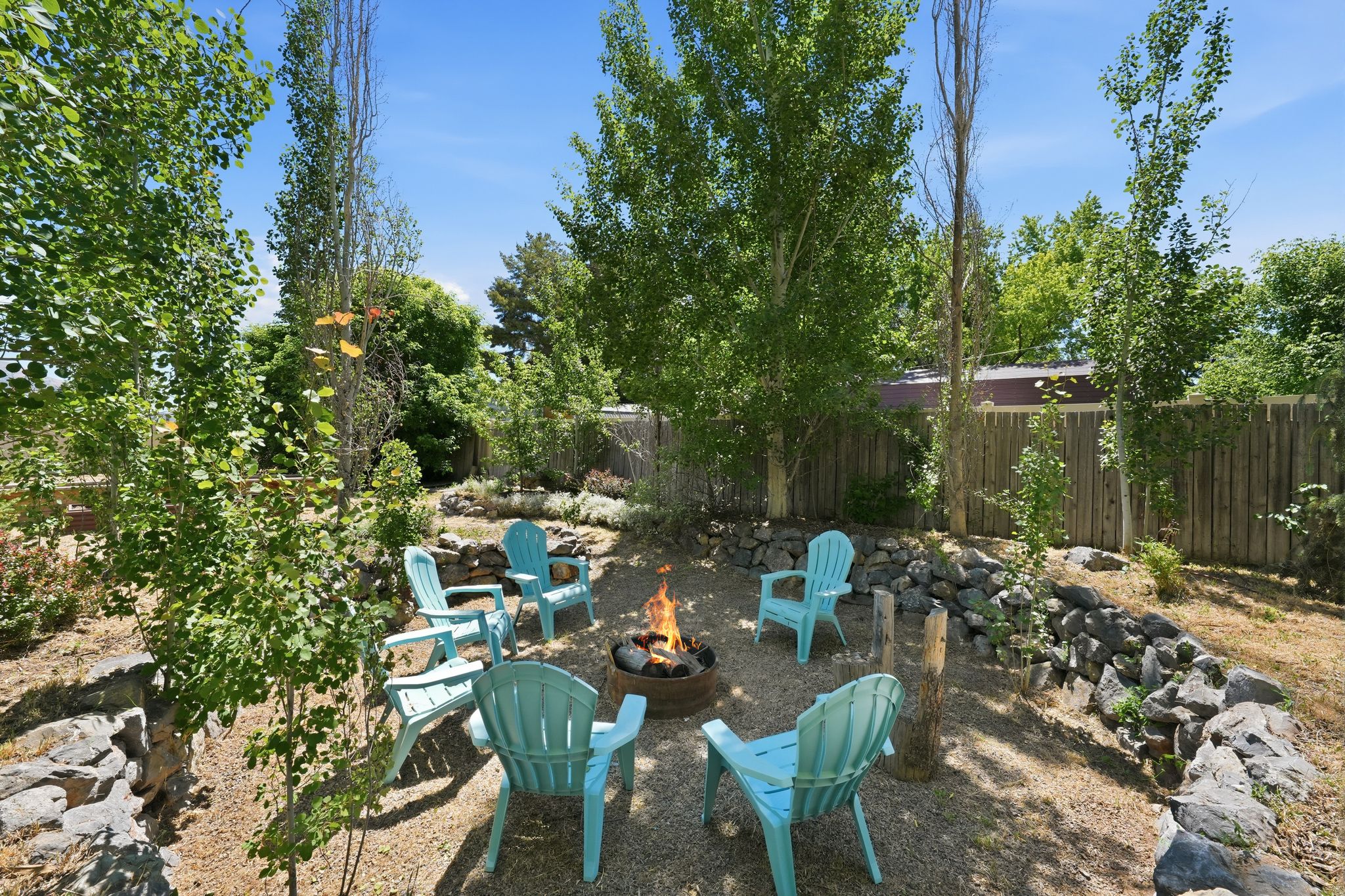 Outdoor fire pit area featuring a gravel ground cover