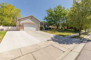 Stucco and brick exterior with a two-car garage