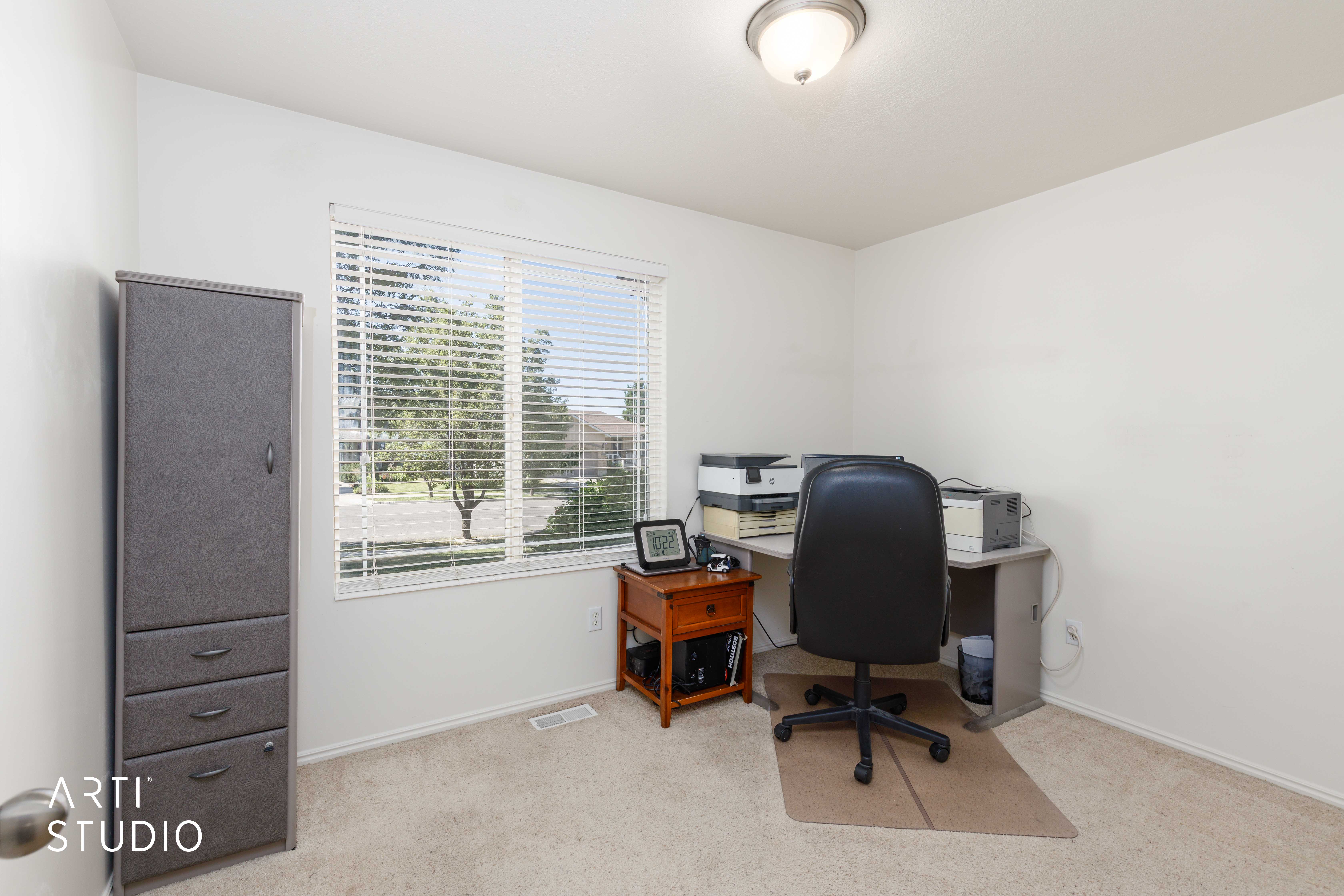 Room with neutral carpeting and white wall paint